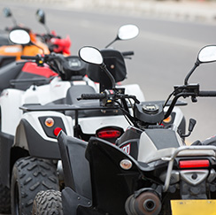 ATVs lined up and ready for heat shields for fuel tanks, mufflers, and fenders