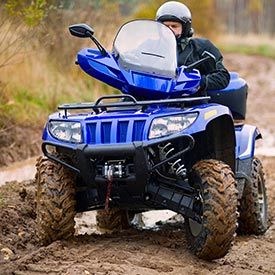 Man riding an ATV with proper engine insulation and isolation mounts for a smooth journey